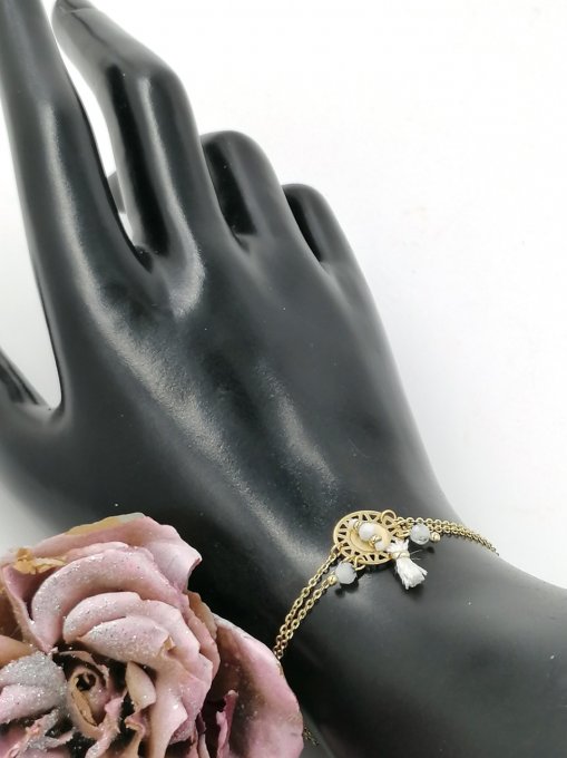 Bracelet en acier inoxydable style attrape rêve perles et pompon blancs